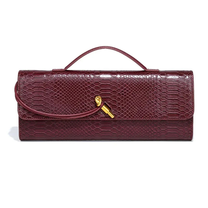 Riviera Rouge – Elegante Croco-Clutch mit Goldverschluss